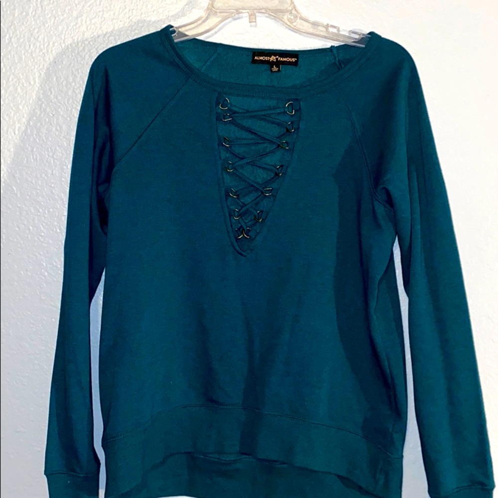 blue fleece long sleeve with gold neck cut out